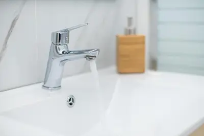 a sink with a faucet in a bathroom at Athens Dreams & Suites Apartments in Athens