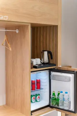an open refrigerator in a kitchen with drinks in it at STARLA STUDIOS in Athens