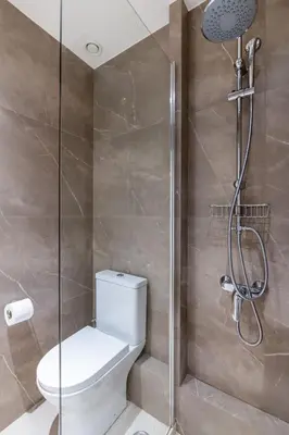 a bathroom with a toilet and a shower at STARLA STUDIOS in Athens
