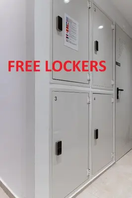 a group of white lockers with the words free lockers at STARLA STUDIOS in Athens