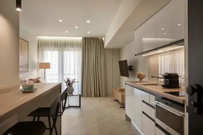 a kitchen and living room with a counter top at Hestia - Asklipiou 61 in Athens