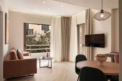 a living room with a couch and a table at Hestia - Asklipiou 61 in Athens