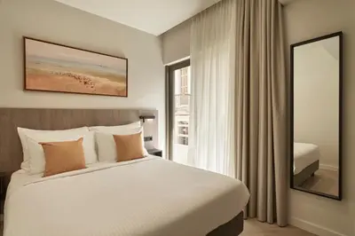 a bedroom with a large bed and a window at Hestia - Asklipiou 61 in Athens