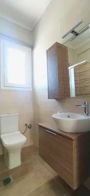 a bathroom with a white sink and a toilet at Experience a nice view appartment-heart of Athens in Athens