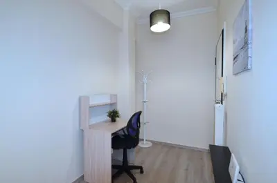 an office with a desk and a chair in a room at A heart apartment at Skouze Hill, Dirrachiou in Athens