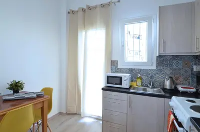 a kitchen with a sink and a microwave at A heart apartment at Skouze Hill, Dirrachiou in Athens