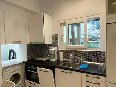 a kitchen with a sink and a counter top at George House in Athens