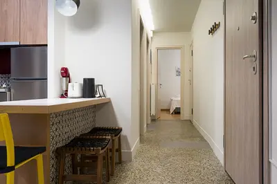 a kitchen with a counter and stools in a room at Athens Special in Athens