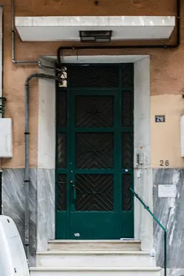 a green door on the side of a building at Athens Special in Athens