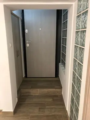 a hallway of a house with a door and glass panels at Μία γκαρσονιέρα με γούστο για επισκέπτες με άποψη in Athens