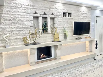 a living room with a fireplace and a tv at Villasonboard 3 Bed Penthouse Veranda Beach view jacuzzi Vouliagmeni Riviera in Athens