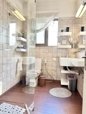 a bathroom with a toilet and a sink at Villasonboard 2 Bed Condo Beach Seaview Greek Riviera Vouliagmeni in Athens