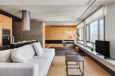 a living room with a white couch and a tv at Syntagma Designers Living in Athens