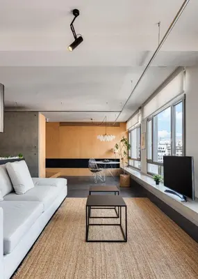 a living room with a white couch and a tv at Syntagma Designers Living in Athens