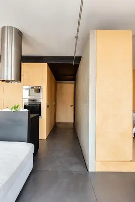 a room with a bed and a kitchen at Syntagma Designers Living in Athens
