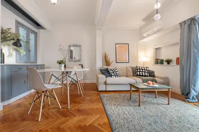 a living room with a couch and a table at Museum Apartment - Fix B, Athens in Athens