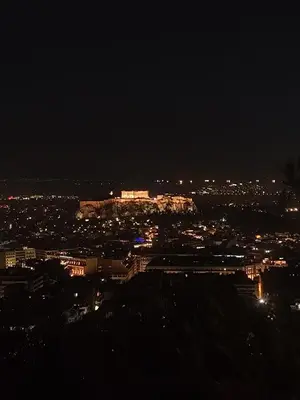a view of a city at night with lights at Diamond Apartment in Athens