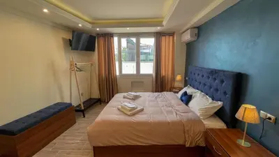 a bedroom with a large bed and a window at Acropolis of Athens from Ermou str in Athens