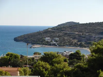 a view of a small island in the ocean at Eri Studios in Agia Marina Aegina