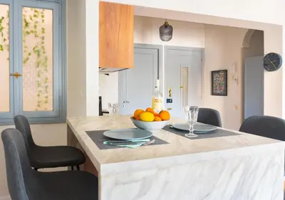 a kitchen with a table with a bowl of fruit on it at Museum Apartment - Fix A, Athens in Athens