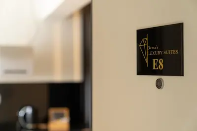 a door with a sign that reads best library services bcb at Dema Luxury Suites - Perikleous E8 in Athens