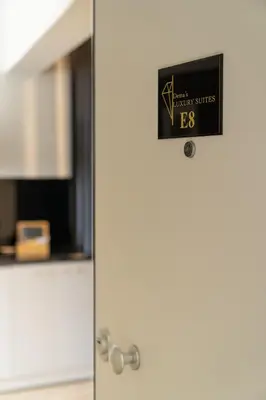 a door with a sign on it in a room at Dema Luxury Suites - Perikleous E8 in Athens
