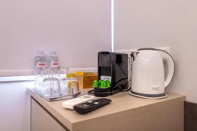 a counter with a coffee maker and a blender on it at Stylish Living - Iro in Athens