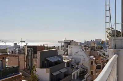 an aerial view of a city with buildings at Acropolis view penthouse in Athens