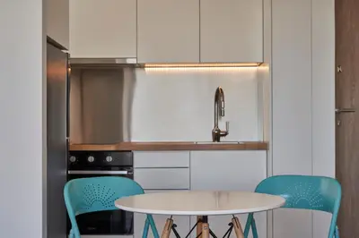 a kitchen with a table and two chairs at Acropolis view penthouse in Athens