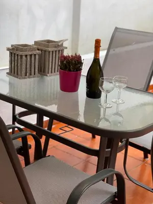 a table with a bottle of wine and two glasses at Athens Studio in Athens