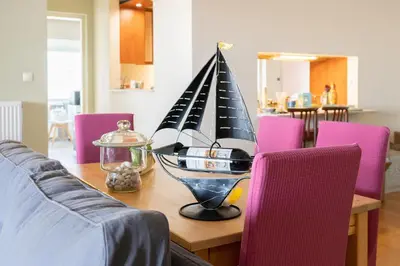 a wooden table with a model boat on top of it at The Skyward Flats in Néa Smírni