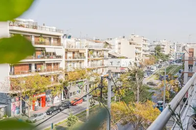 a view of a city street with buildings at The Skyward Flats in Néa Smírni