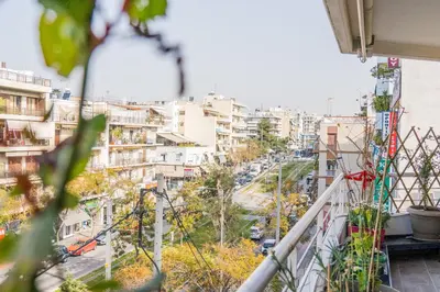 a view from a balcony of a city with buildings at The Skyward Flats in Néa Smírni