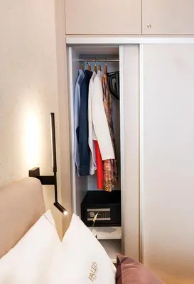 a room with a closet with clothes in it at Paleo Suites in Athens
