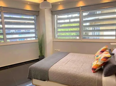 a bedroom with a bed and two windows at NEW AmazingLarge Luxury 4BR Suite/1min toAcropolis in Athens