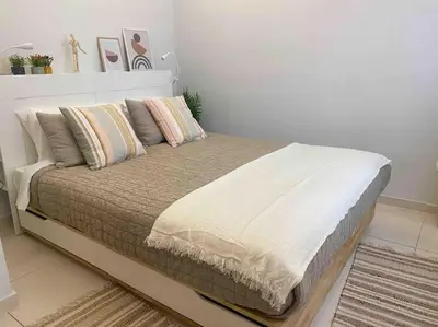 a large bed in a bedroom with a white wall at NEW AmazingLarge Luxury 4BR Suite/1min toAcropolis in Athens