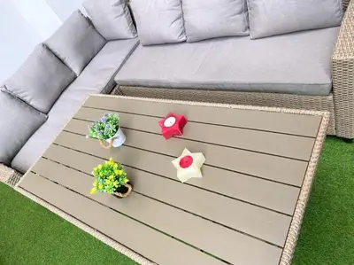 a couch with three plants on a coffee table at NEW AmazingLarge Luxury 4BR Suite/1min toAcropolis in Athens