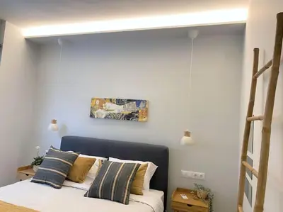 a bedroom with a bed and a painting on the wall at NEW AmazingLarge Luxury 4BR Suite/1min toAcropolis in Athens