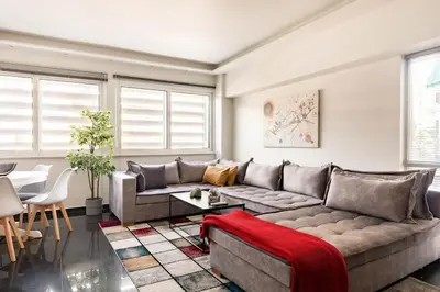 a living room with a couch and a table at NEW AmazingLarge Luxury 4BR Suite/1min toAcropolis in Athens