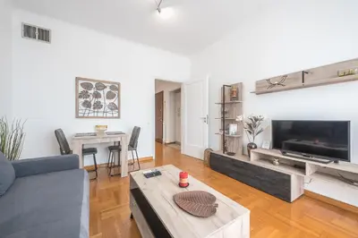 a living room with a couch and a table at The 