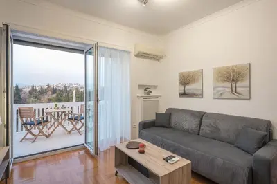 a living room with a couch and a table at The 