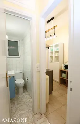 a bathroom with a toilet and a sink at MELMA PROPERTIES-AMAZONE-premium apartment in Piraeus center in Piraeus