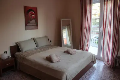 a bedroom with a bed with two pillows on it at Capital apartment next to Metro station with parking spot to explore Athens in Athens