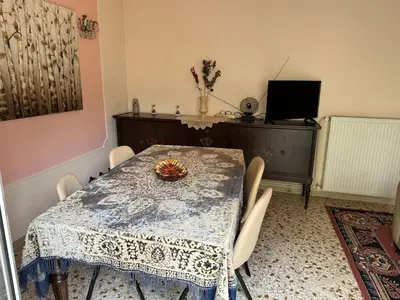 a dining room with a table and chairs at Capital apartment next to Metro station with parking spot to explore Athens in Athens