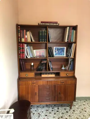 a wooden book shelf with books on it at Capital apartment next to Metro station with parking spot to explore Athens in Athens