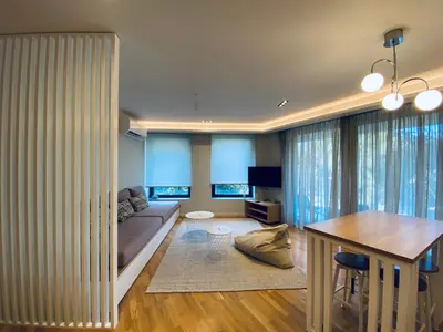 a living room with a couch and a table at Acropolis Residence #Rooftop#360-Degree City Views #Unoblu in Athens