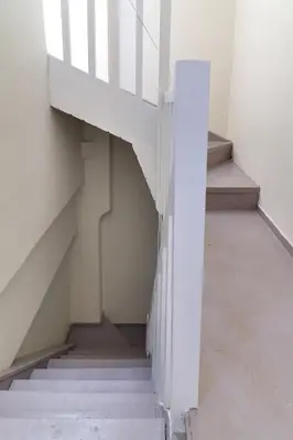 a staircase in a building with white stairs at athensvintage in Athens