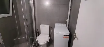 a small bathroom with a toilet and a shower at Location...Acropolis! in Athens