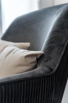 a black couch with two pillows on it at Spacious 2BD apt next to metro in Athens