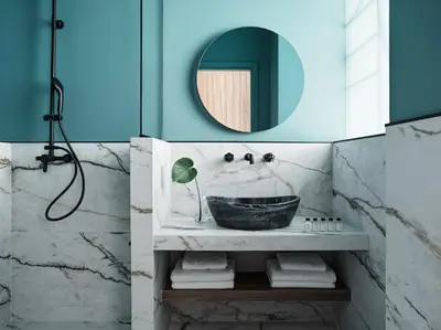 a bathroom with a sink and a mirror at Athens City View Urban Suites in Athens